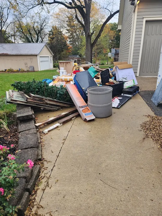 Dumpster being loaded with debris for Commercial Dumpster Rental in Kalamazoo